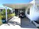 Mobile home with carport and golf cart at 218 Trailorama Dr, North Port, FL 34287