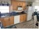 Bright kitchen featuring ample cabinetry, modern appliances, and a dishwasher at 218 Trailorama Dr, North Port, FL 34287