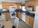 Bright kitchen with wood cabinets and modern appliances at 218 Trailorama Dr, North Port, FL 34287