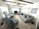 Comfortable living room featuring two sofas, a recliner, and ceiling fan at 218 Trailorama Dr, North Port, FL 34287
