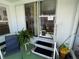 View of kitchen through the screened porch at 218 Trailorama Dr, North Port, FL 34287