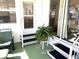 Steps leading to a screened porch at 218 Trailorama Dr, North Port, FL 34287