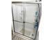 Clean shower with glass sliding doors and built-in shelves at 218 Trailorama Dr, North Port, FL 34287