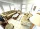 Bright sunroom featuring comfortable seating and ample natural light at 218 Trailorama Dr, North Port, FL 34287