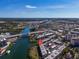 Stunning aerial shot showcasing the complex near waterways, a bridge, and the vibrant city at 250 Santa Maria St # 219, Venice, FL 34285