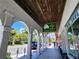 Charming storefront arcade with white columns and a variety of shops and eateries, offering a vibrant shopping experience at 250 Santa Maria St # 219, Venice, FL 34285