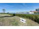 Serene waterfront backyard area, complete with benches and manicured hedges at 250 Santa Maria St # 219, Venice, FL 34285