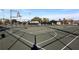 View of a fenced outdoor basketball court with multiple hoops in a park setting at 250 Santa Maria St # 219, Venice, FL 34285