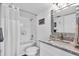 Bathroom with tub, granite countertop, and modern fixtures at 250 Santa Maria St # 219, Venice, FL 34285