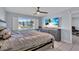 Main bedroom with water view, large bed, and modern dresser at 250 Santa Maria St # 219, Venice, FL 34285