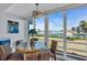 Waterfront dining area featuring a round table and four chairs at 250 Santa Maria St # 219, Venice, FL 34285