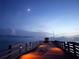 Picturesque Venice Fishing Pier at dusk, extending into the tranquil sea under a serene moonlit sky at 250 Santa Maria St # 219, Venice, FL 34285