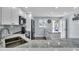 Modern kitchen with double sink, granite counters and stainless steel appliances at 250 Santa Maria St # 219, Venice, FL 34285