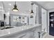 Modern kitchen with breakfast bar, stainless steel appliances, and granite counters at 250 Santa Maria St # 219, Venice, FL 34285