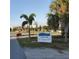 Roadside signage for Legacy Park, showing the address and trees surrounding the park at 250 Santa Maria St # 219, Venice, FL 34285