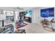 Living room with comfortable seating and large TV at 250 Santa Maria St # 219, Venice, FL 34285