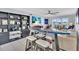 Relaxing living area with water views and unique surfboard table at 250 Santa Maria St # 219, Venice, FL 34285