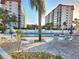 Inviting community pool area surrounded by well-maintained buildings and lush landscaping at 250 Santa Maria St # 219, Venice, FL 34285