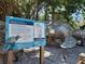 Environmental art installation of a sea turtle sculpture with educational signage about marine debris at 250 Santa Maria St # 219, Venice, FL 34285