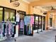 Local shops with colorful clothing racks and displays, inviting passersby to explore the boutiques at 250 Santa Maria St # 219, Venice, FL 34285