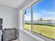 Bedroom with large window showcasing waterfront views at 250 Santa Maria St # 219, Venice, FL 34285