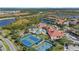 Community overview featuring resort-style pool, tennis courts, and clubhouse at 2539 Brassica Dr, North Port, FL 34289