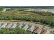 Aerial view of homes, street, and nature at 2539 Brassica Dr, North Port, FL 34289