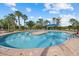 Circular community pool with a central island at 2539 Brassica Dr, North Port, FL 34289