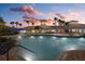 Evening view of resort-style pool and clubhouse at 2539 Brassica Dr, North Port, FL 34289