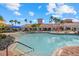 Resort-style community pool with plenty of lounge chairs at 2539 Brassica Dr, North Port, FL 34289