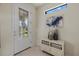 Bright entryway with decorative accents and a large glass door at 2539 Brassica Dr, North Port, FL 34289