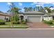 Attractive single-story home with a two-car garage and landscaped yard at 2539 Brassica Dr, North Port, FL 34289