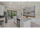 Modern kitchen with a large island, stainless steel appliances, and white cabinetry at 2539 Brassica Dr, North Port, FL 34289