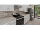 Sleek kitchen with quartz countertops and stainless steel appliances at 2539 Brassica Dr, North Port, FL 34289