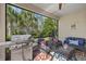 Relaxing screened lanai with outdoor seating and grill at 2539 Brassica Dr, North Port, FL 34289