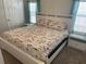 Spacious bedroom with king-size bed and nightstands at 334 Blackburn Blvd, North Port, FL 34287