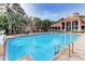 Large community pool with surrounding lounge area at 4142 Central Sarasota Pkwy # 1415, Sarasota, FL 34238