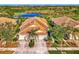 Community overview showcasing homes near a pond and golf course at 4245 Whispering Oaks Dr, North Port, FL 34287