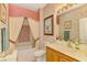 Bathroom with tub shower combo and updated vanity at 4245 Whispering Oaks Dr, North Port, FL 34287