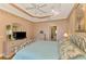 Spacious Primary bedroom with ensuite bathroom and hardwood floors at 4245 Whispering Oaks Dr, North Port, FL 34287