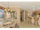 Bright breakfast nook with view into kitchen and access to pantry at 4245 Whispering Oaks Dr, North Port, FL 34287