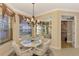 Charming breakfast nook with a round table and built-in seating at 4245 Whispering Oaks Dr, North Port, FL 34287