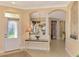 Elegant entryway with high ceilings and tile floors at 4245 Whispering Oaks Dr, North Port, FL 34287