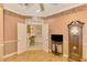 Open hallway with views into a wet bar and living space at 4245 Whispering Oaks Dr, North Port, FL 34287
