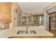 Kitchen with double sink and a view to the dining and living room at 4245 Whispering Oaks Dr, North Port, FL 34287