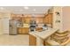 Spacious kitchen with stainless steel appliances and an island at 4245 Whispering Oaks Dr, North Port, FL 34287