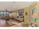 Spacious living room with hardwood floors and large windows at 4245 Whispering Oaks Dr, North Port, FL 34287