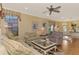 Light and airy living room with hardwood floors and comfortable seating at 4245 Whispering Oaks Dr, North Port, FL 34287