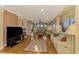 Spacious living room with hardwood floors and large windows at 4245 Whispering Oaks Dr, North Port, FL 34287