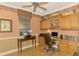 Home office with built-in cabinetry and hardwood floors at 4245 Whispering Oaks Dr, North Port, FL 34287